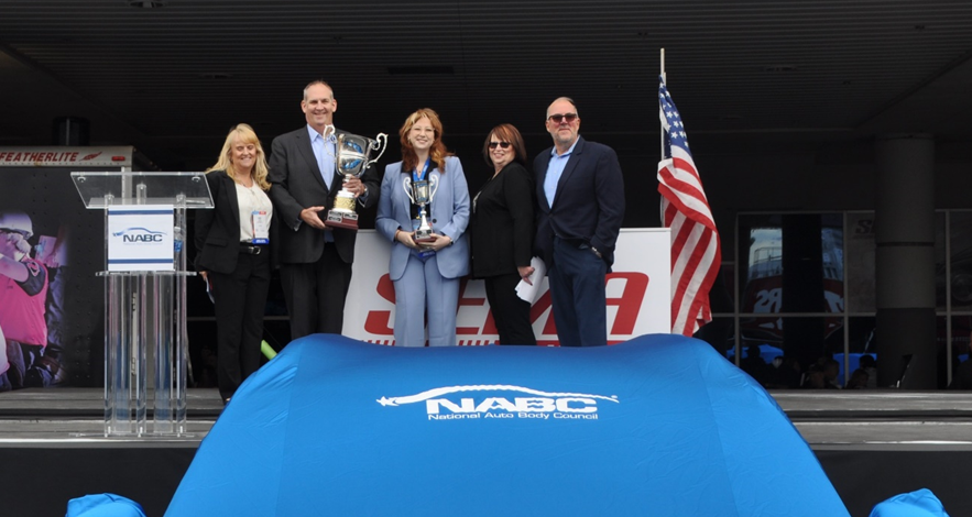Emily Quinn accepting The NABC® Changing and Saving Lives Award on behalf of her father, Michael Quinn. Scott Sampley accepting the NABC® President’s Award on behalf of his organization.