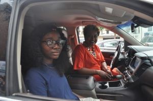 two women sitting in a car