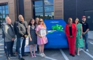 Amy Dossier and family receive their Recycled Rides vehicle