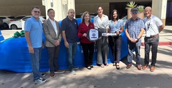 Victoria Cook-Minshue receiving her NABC Recycled Rides vehicle at a presentation at Collision Next 2026 at the Hilton Anaheim in Anaheim, CA